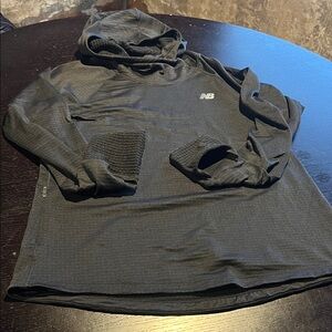 New Balance Heat running top. Black. No size tag seems large or x large.